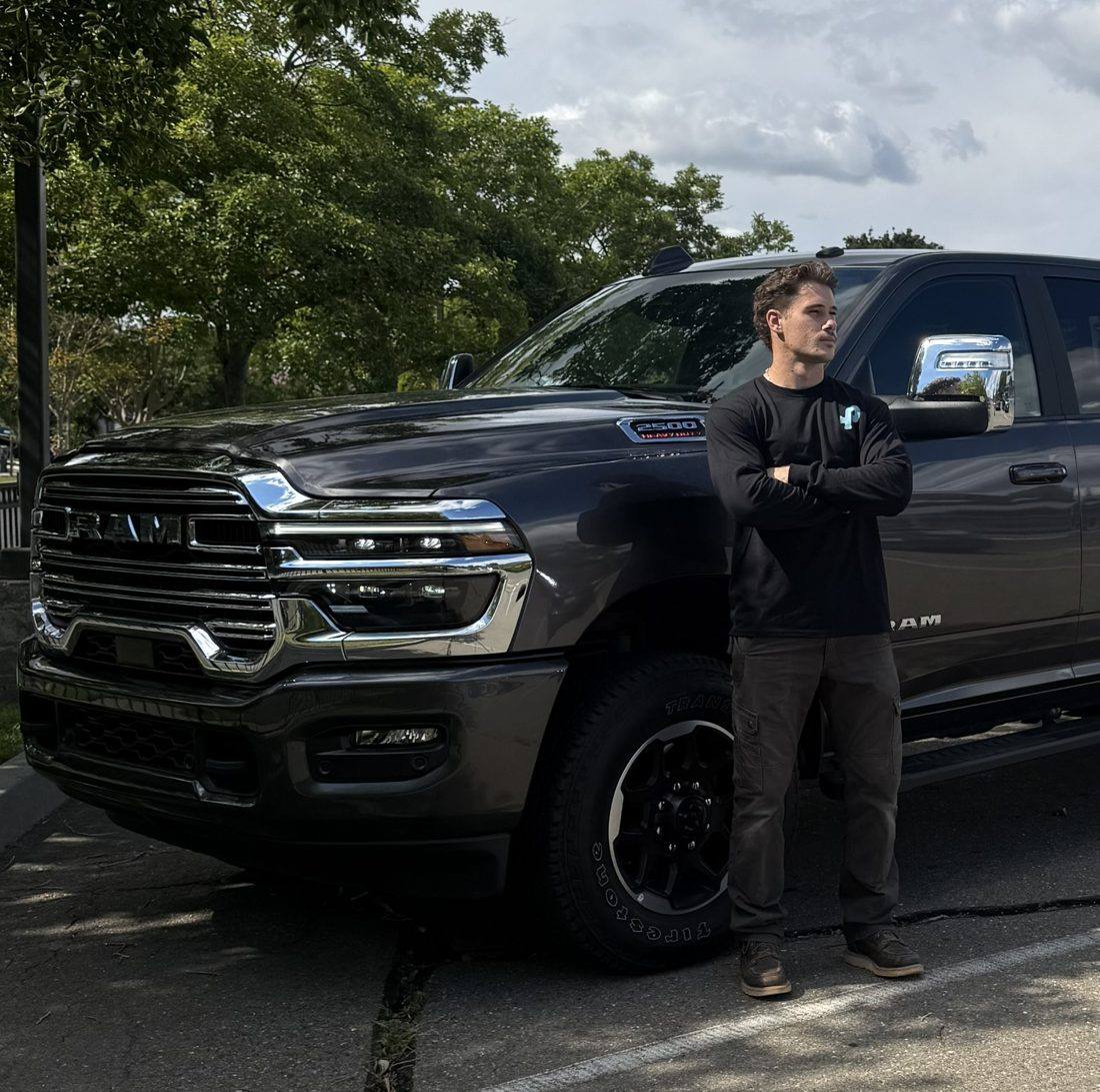 Poly Plumbing owner with company service truck in the Sacramento area